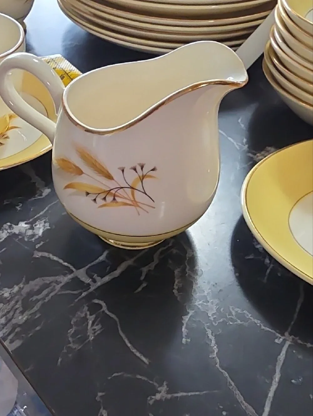 Yellow and White Floral Dinnerware with Gold Trim Accents